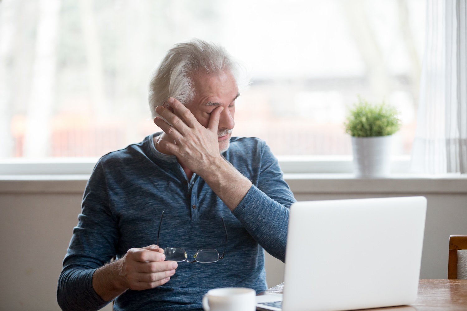 man suffering with dry eyes